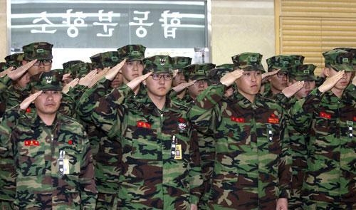 South Korean marines salute their fellow troops killed in a North Korean bombardment, during a memorial service in South Korea, Nov. 24, 2010. (AP)