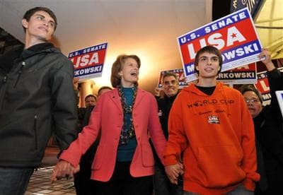 At center, United States Senator Lisa Murkowski (R) Alaska walks to Anchorage, Alaska&#039;s election central with sons Nick, left and Matt. (AP)