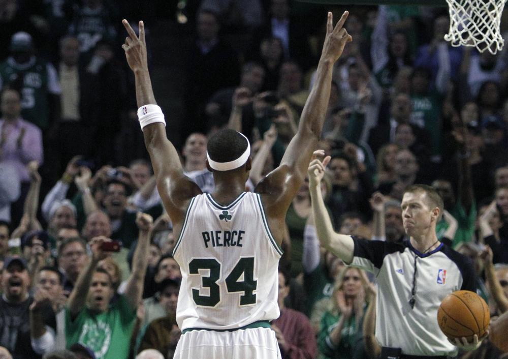 Boston's Paul Pierce celebrates after making his 20,000th career point on a free throw in overtime during an NBA basketball game against Milwaukee Bucks on Wednesday in Boston. The Celtics won 105-102. (AP)
