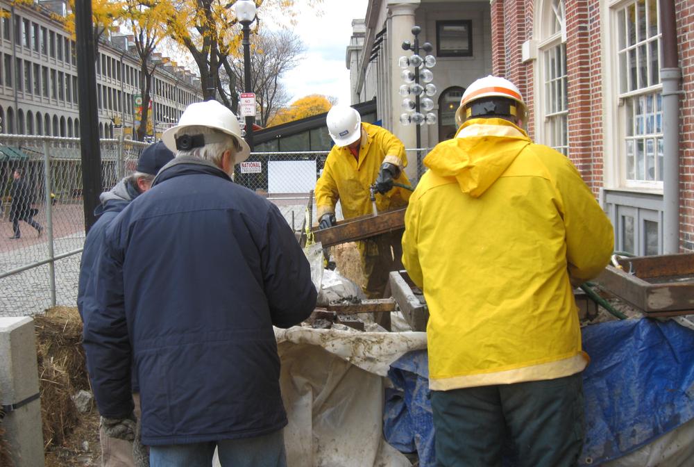 Researchers and archaeologists are hoping to study Boston's past by digging up parts of Faneuil Hall. (Adam Ragusea/WBUR)
