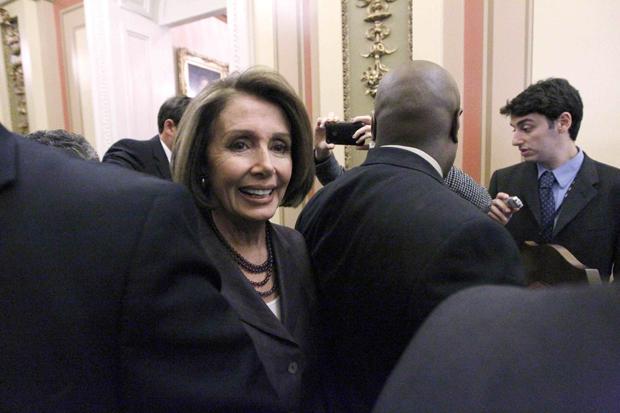 Speaker Nancy Pelosi heads through the Capitol for a TV interview Wednesday, the day after House Democrats sustained huge election losses. (AP)