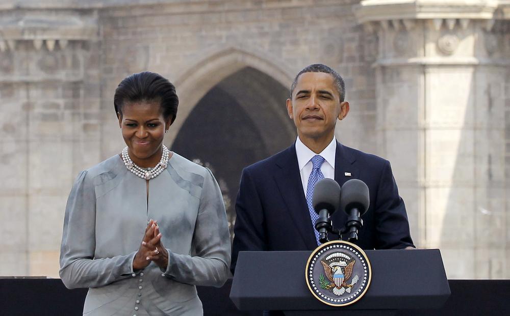 President Barack Obama and first lady Michelle Obama make a statement after their visit the memorial for the Nov. 26, 2008 terror attack victims at the Taj Mahal Palace and Tower Hotel in Mumbai, India, Saturday, Nov. 6, 2010. (AP Photo/Charles Dharapak)