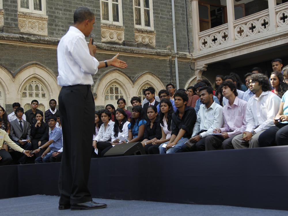 President Barack Obama on stage as he answers questions during a town hall meeting with students at St. Xavier's College in Mumbai, India, Sunday. (AP Photo/Pablo Martinez Monsivais)