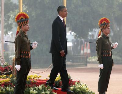 President Obama walks out to begin to review the honor guard during an arrival ceremony at Rashtrapati Bhavan in New Delhi, India, Monday. (AP)