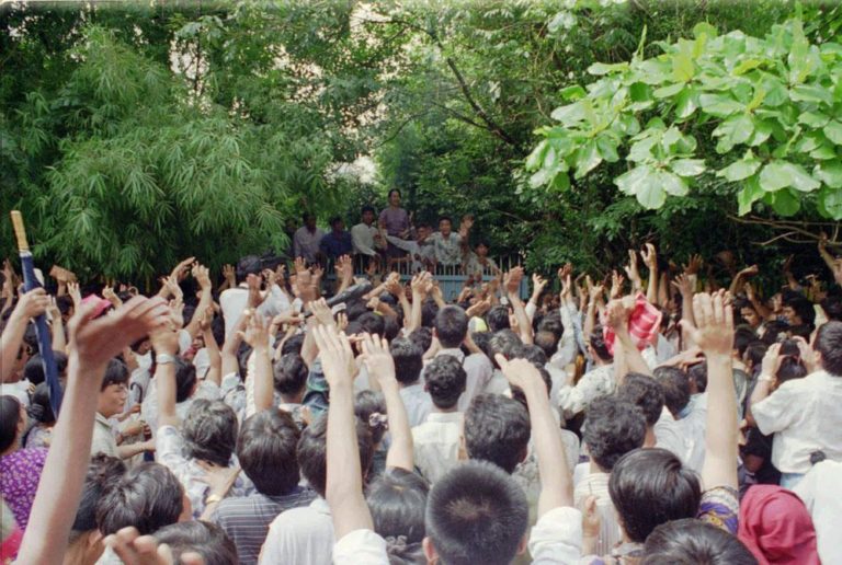 Burmese pro-democracy leader Aung San Suu Kyi is greeted by jubilant crowd on Tuesday, July 11, 1995 after she was released from house arrest in Rangoon. (AP)