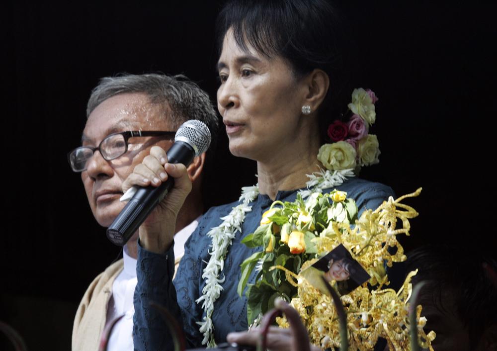 Myanmar pro-democracy leader Aung San Suu Kyi delivers a speech to supporters at the headquarters of her National League for Democracy Party on Sunday.  (AP Photo/Khin Maung Win)