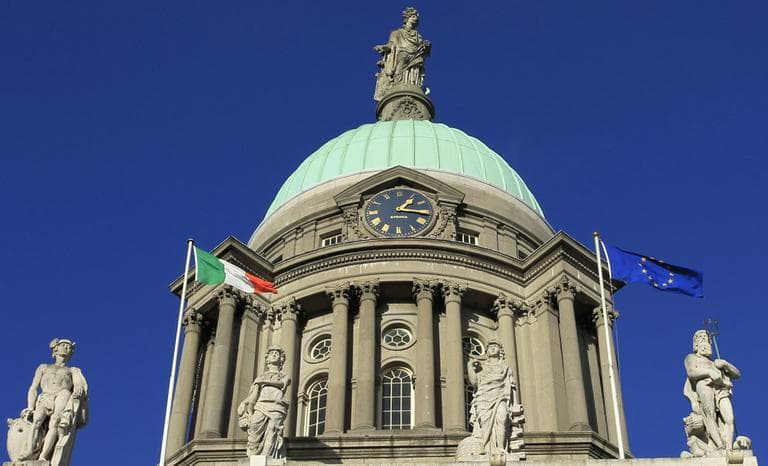 The Irish Flag flys alongside the European Union flag outside the Customs Building, Dublin. (AP)