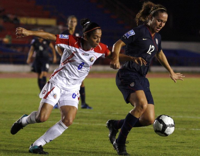 United States' Lauren Cheney, right, battles for the ball with Costa Rica's Daniela Cruz during a 2010 Women's World Cup qualifier soccer match in Cancun, Mexico, Monday Nov. 1, 2010. (AP)