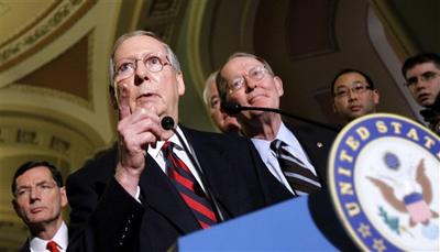 Senate Minority Leader Mitch McConnell of Ky., second from left, accompanied by Sen. John Barrasso, R-Wyo., left, and Sen. Lamar Alexander, R-Tenn., gestures during a news conference on Capitol Hill in Washington. (AP)