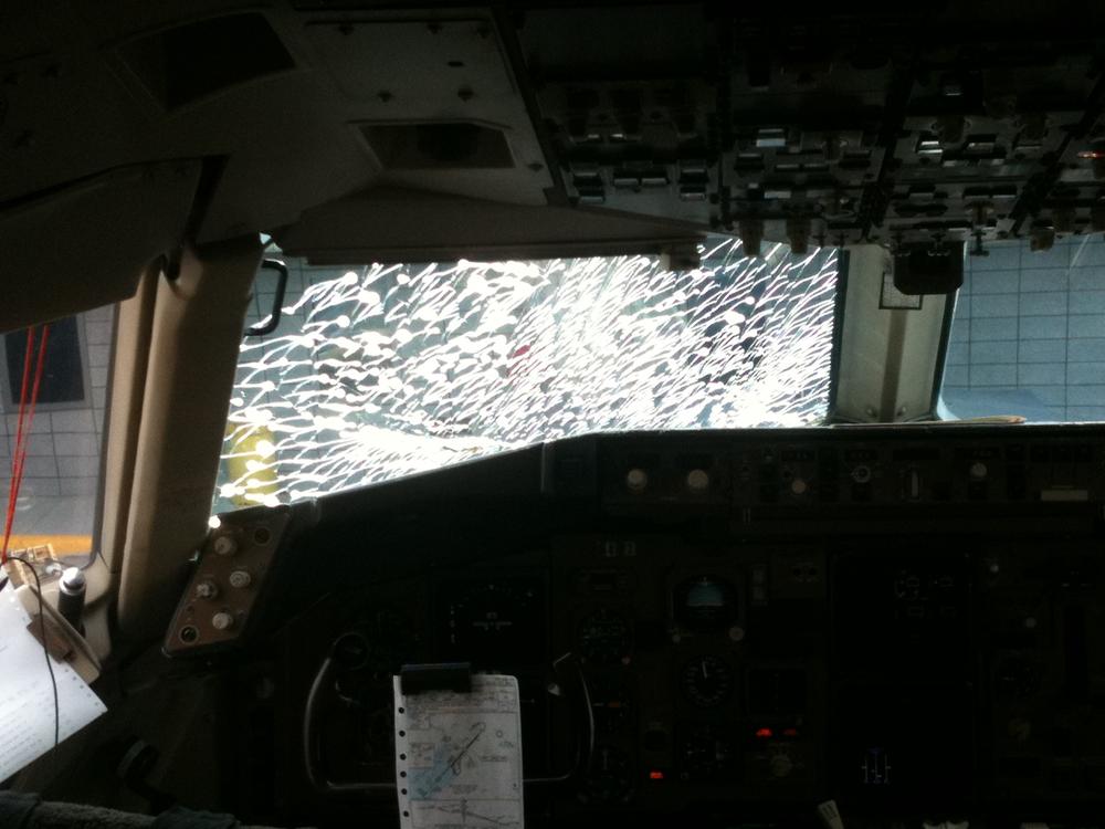 Cracked windshield in the cockpit of United Flight 881 (Andrew Phelps/WBUR)