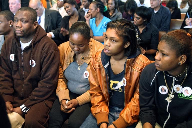 Friends and family of the victims attend the arraignment of Dwayne Moore Tuesday in Dorchester. Moore was not seen in court. (AP)