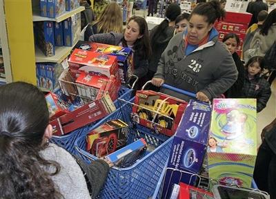 Black Friday shoppers negotiate a traffic jam in the aisles of Toys R Us in San Rafael, Calif. (AP)