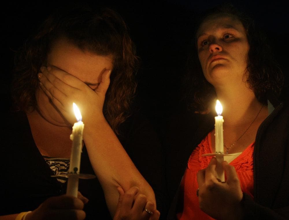 Julie Jones, left, and Cassie Jones, comfort each other during a vigil in Mullens, W.Va., Saturday, April 10, 2010, to commemorate the 29 miners who were killed in an explosion at Massey Energy Co.'s Upper Big Branch mine. They are family members of coal miner Dean Jones who was killed in the explosion. (AP)