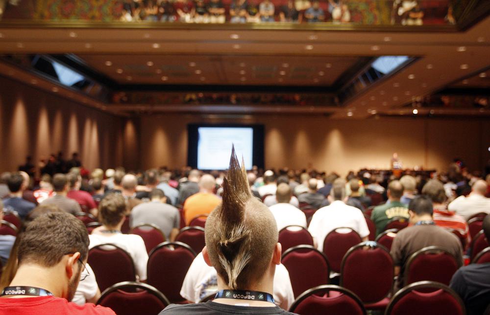 People listen to a presentation during the DefCon hacker conference in Las Vegas (AP)