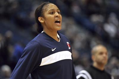 Connecticut guard Maya Moore warms up before an exhibition game in Hartford on Wednesday. The Huskies&#039; winning streak is closing in on an NCAA record. (AP Photo) 