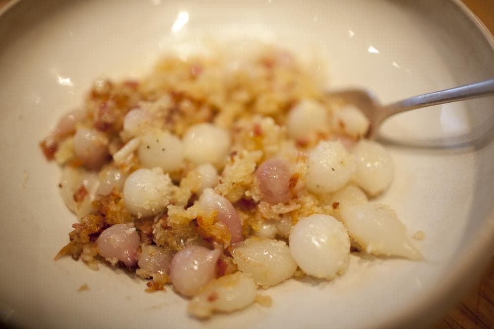 Pearl onions with panko breadcrumbs, cream, butter, and bacon. (Nicholas Dynan)