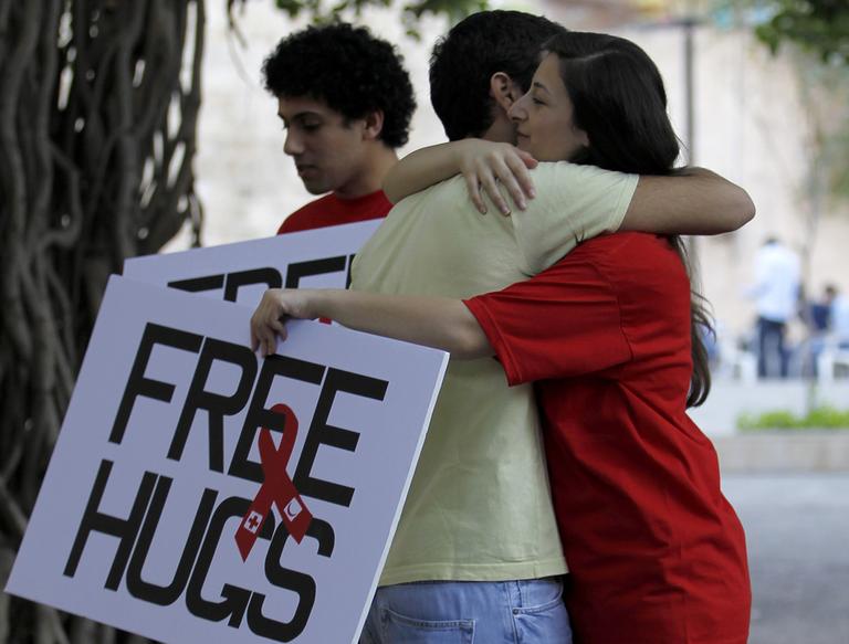 Students of the American University of Beirut hug each other during the &quot;Free Hugs: Hugging is really not contagious&quot; campaign  on campus in Beirut, Lebanon, Wednesday.