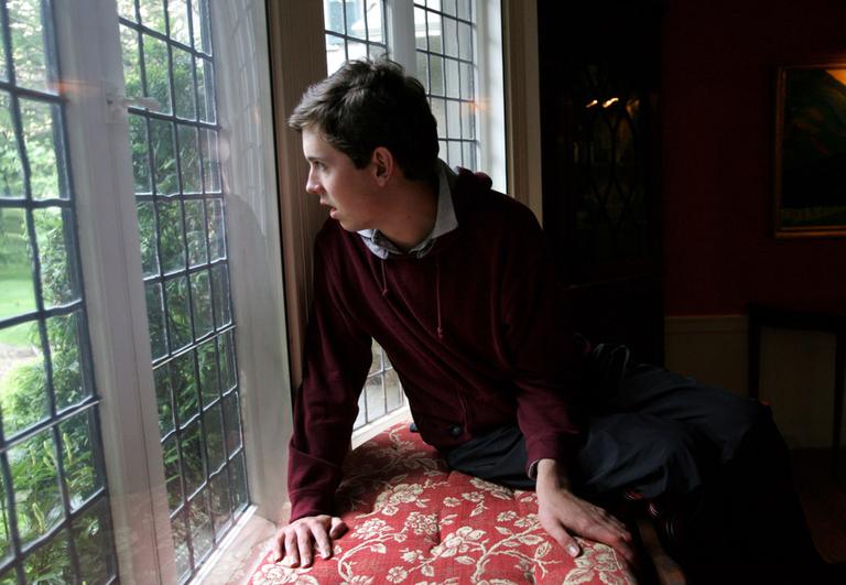Music student Tony Bacon, of Beverly, Mass., waits for the arrival of his teacher at his Beverly home, in this  June 7, 2006 file photo. His teacher, Music Therapist Krystal Demaine, utilizes music as a form of therapy to help autistic children, including Bacon, acquire and improve language skills. (AP)