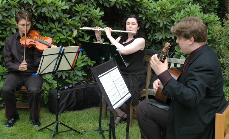 A trio from the Longy School of Music performs at a benefit for Mt. Auburn Cemetary. (friendsofmountauburn/Flickr)