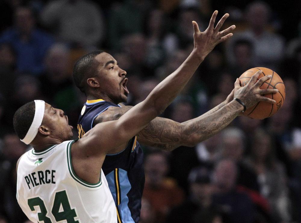 Denver Nuggets guard J.R. Smith, right, drives past Boston Celtics forward Paul Pierce during the second quarter of an NBA basketball game in Boston on Wednesday.(AP)