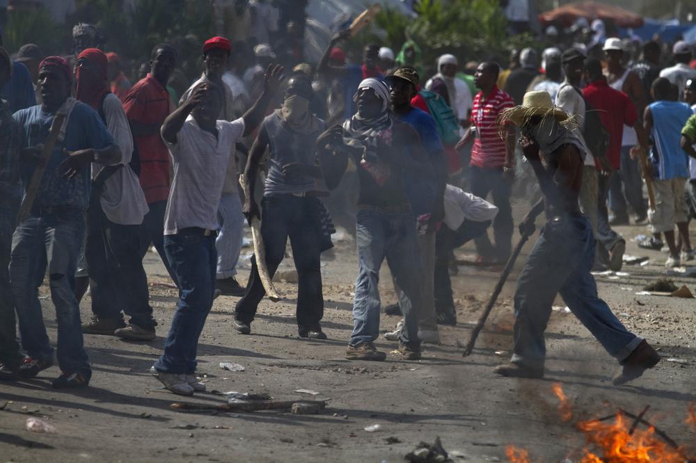 Supporters of presidential candidate Michel Martelly protest in Port-au-Prince, Haiti, after officials announced that Martelly would not advance to a presidential election runoff. (AP)