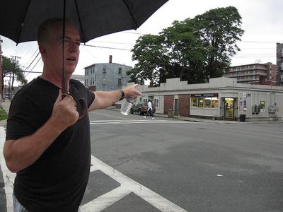 Richie Farrell points out landmarks from his past as a drug addict in Lowell, Massachusetts. (Huda Alhamda)