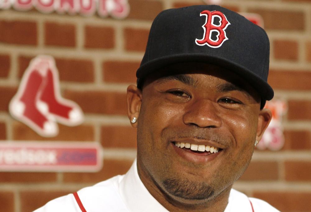 Carl Crawford smiles at a news conference announcing his signing by the Boston Red Sox at Fenway Park  Saturday. (AP Photo/Winslow Townson)
