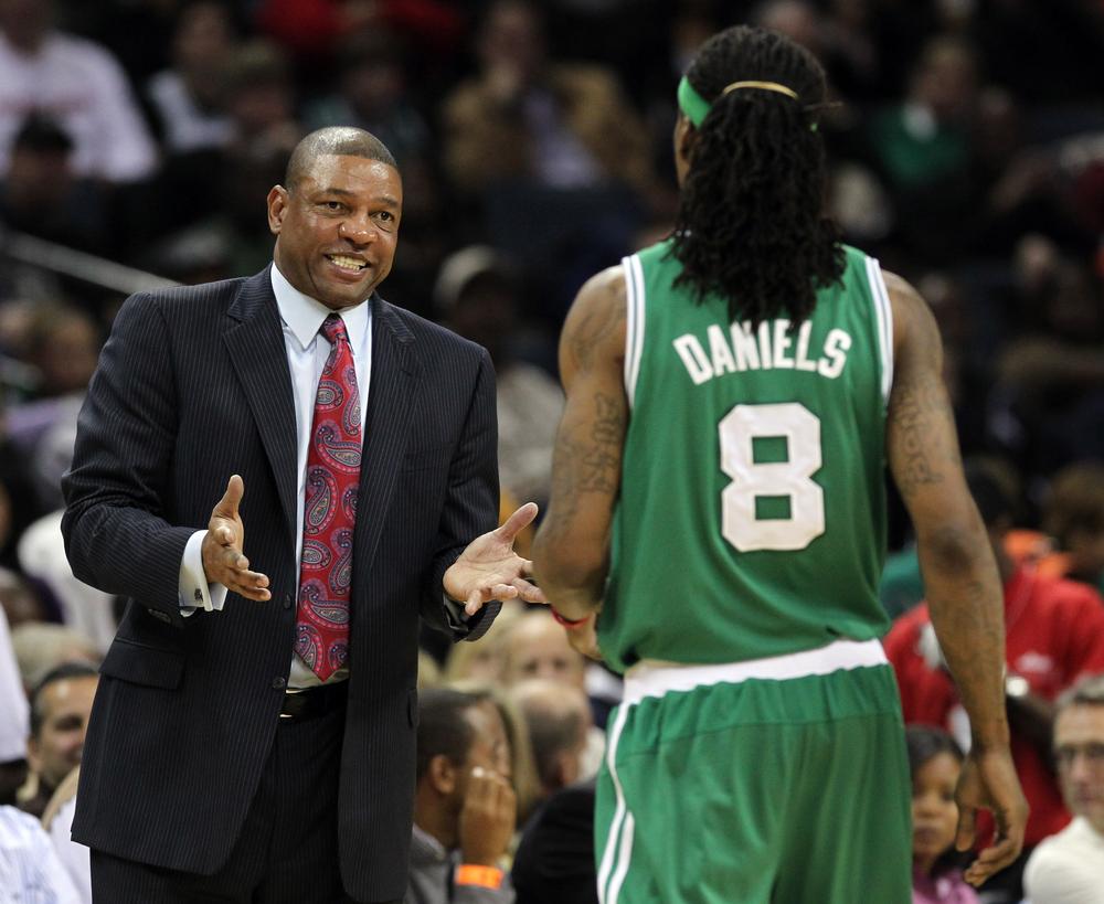 Celtics coach Doc Rivers, left, talks with Celtics guard Marquis Daniels in the second half against the Bobcats in Charlotte, N.C., Saturday. (AP)