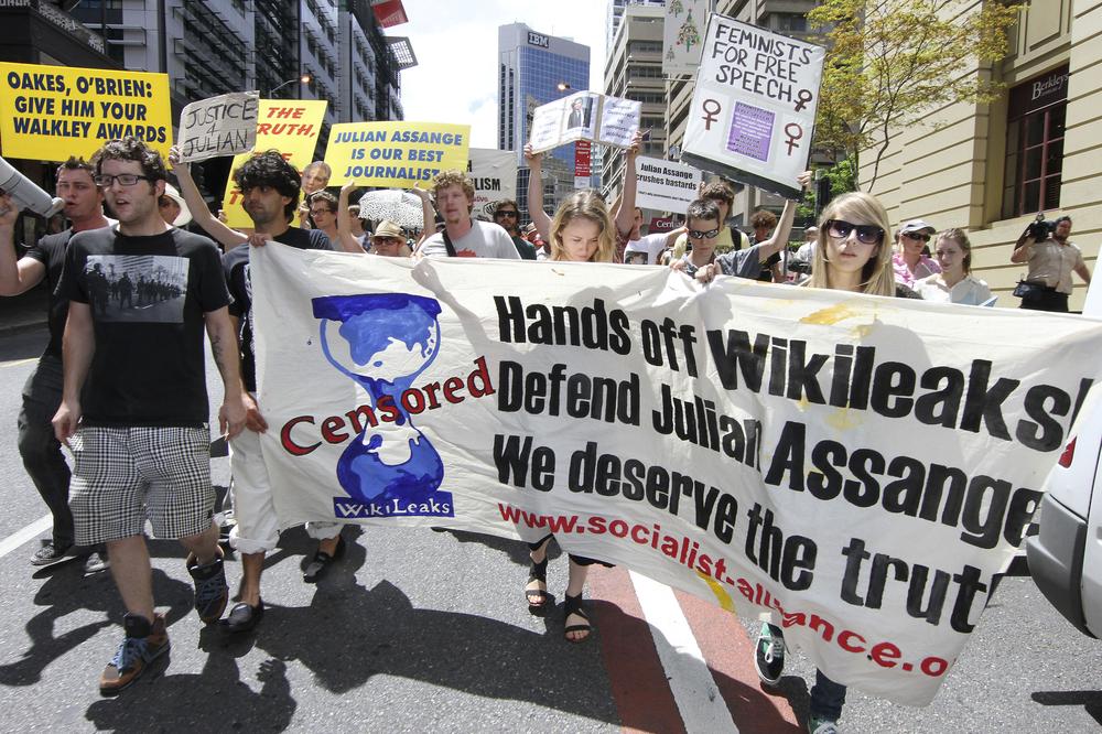 Hundreds of protestors march through Brisbane's city center to protest against the detention of WikiLeaks founder, Julian Assange, in Brisbane, Australia. (AP)
