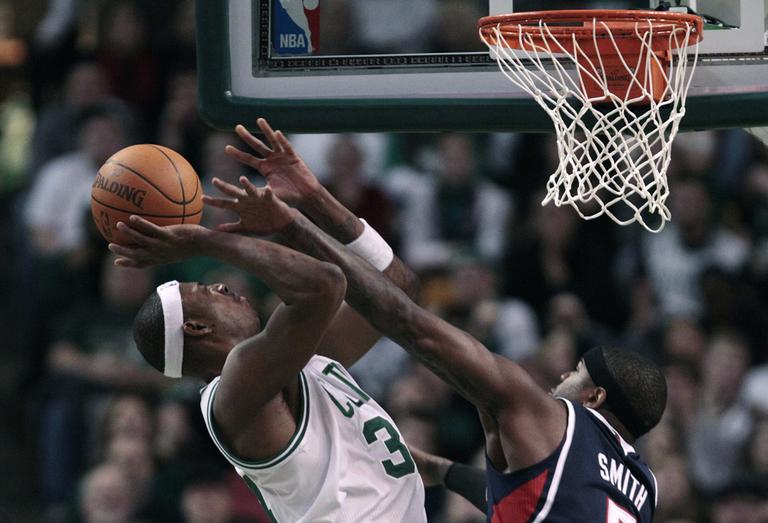 Boston forward Paul Pierce shoots over Atlanta forward Josh Smith during the second half of the game in Boston on Thursday. The Celtics beat the Hawks 102-90. (AP)
