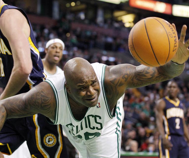 Boston's Shaquille O'Neal dives for a rebound during the second half of the game against Indiana in Boston on Sunday. The Celtics beat the Pacers, 99-88. (AP)