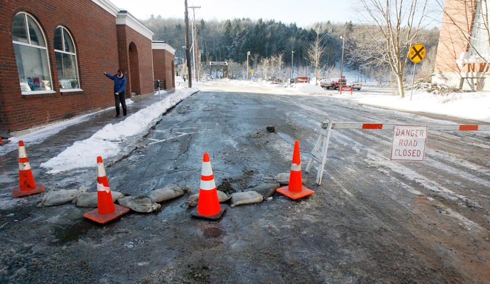 A pedestrian slips on an icy sidewalk in Montpelier, Vt., in this December 2009 file photo. (Toby Talbot/AP)