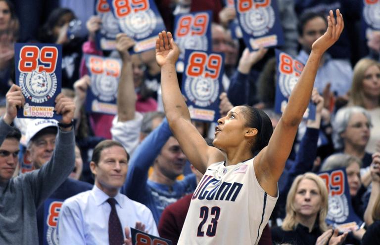 Connecticut forward Maya Moore celebrates near the end of an NCAA college basketball game against Florida State in Hartford, Conn., on Tuesday. Connecticut beat Florida State 93-62 to to set an NCAA record for consecutive wins, at 89. (AP)