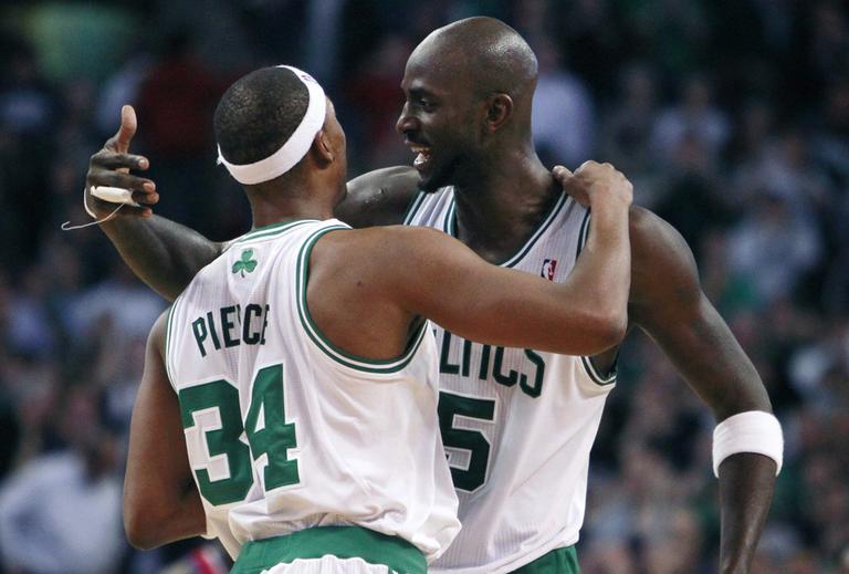Boston's Paul Pierce (34) and Kevin Garnett celebrate with seconds left in the fourth quarter of the game against Philadelphia on Wednesday in Boston. The Celtics won 84-80. (AP)