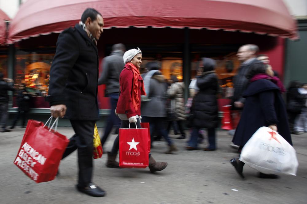Shoppers walk along 34th Street, in New York City. (AP)