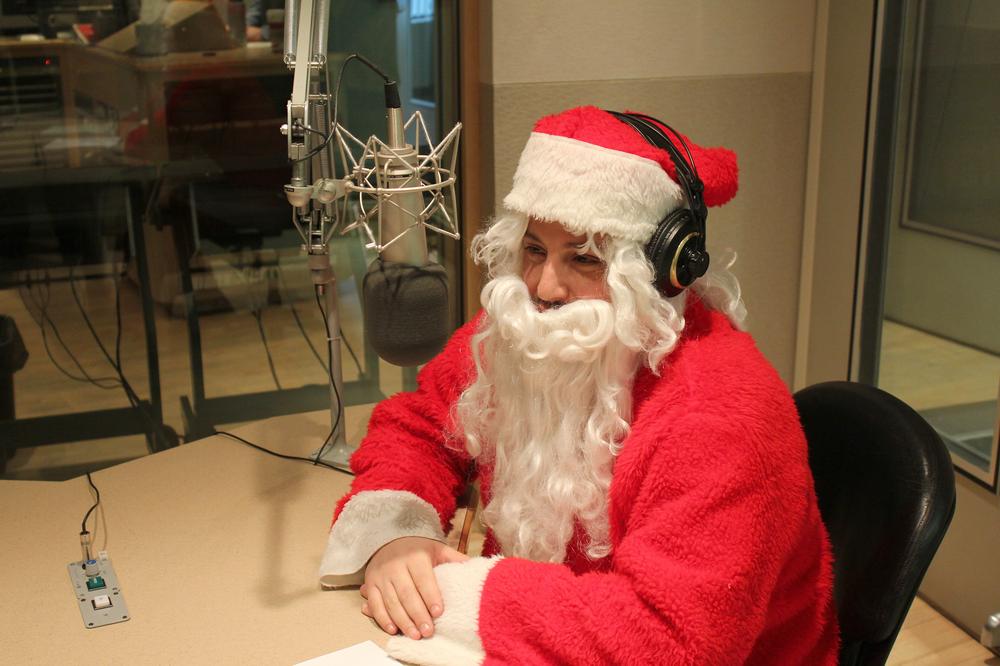 Poet Jim Behrle stopped by WBUR Thursday in his Santa Claus costume. (Jeremy Bernfeld for WBUR)