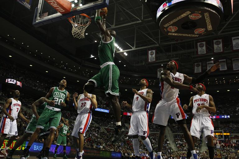 Boston power forward Kevin Garnett (5) dunks against Detroit in the second quarter of the game in Auburn Hills, Mich. on Wednesday. Garnett left after the play with an injury (AP)