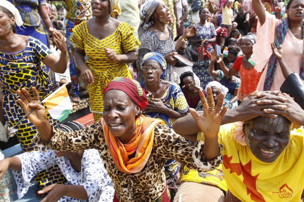 Members of the Women&#039;s Christian Association pray for peace in Abidjan, Ivory Coast. (AP)