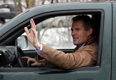 From his famous pickup truck, Scott Brown waves to supporters after voting in his successful race for U.S. Senate. (AP)