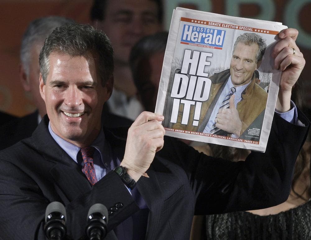 In this Jan. 19, 2010 file photo, then-Massachusetts Sen.-elect Scott Brown, R-Mass., holds up a Boston Herald newspaper during his victory party in Boston. (AP)