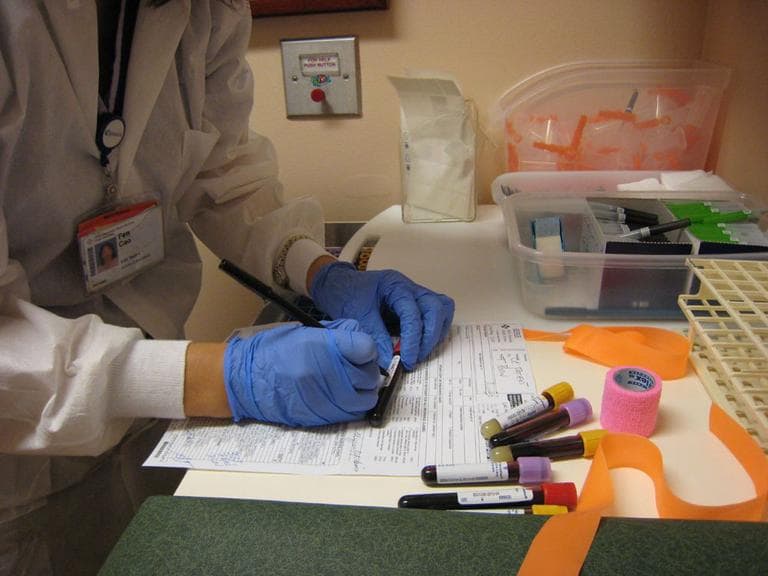 A hospital technician processing bloodtests. (Neeta Lind/Flickr)