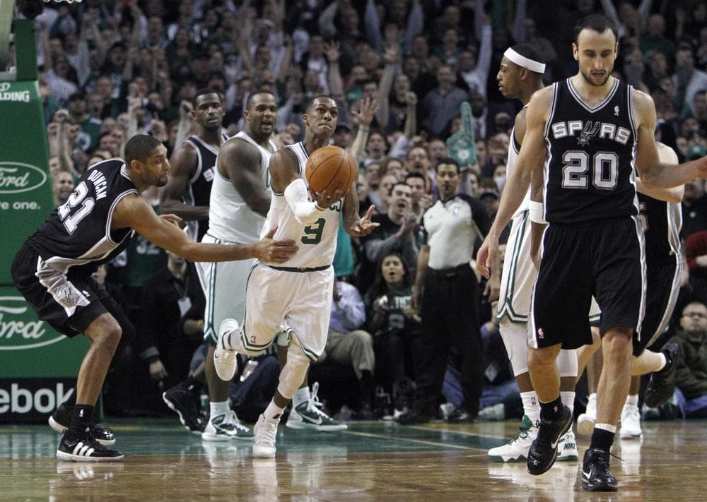 Boston&#039;s Rajon Rondo (9) gets ready to toss the ball in the air after getting the rebound on a shot by San Antonio&#039;s Manu Ginobili (20) during the game on Wednesday. (AP)