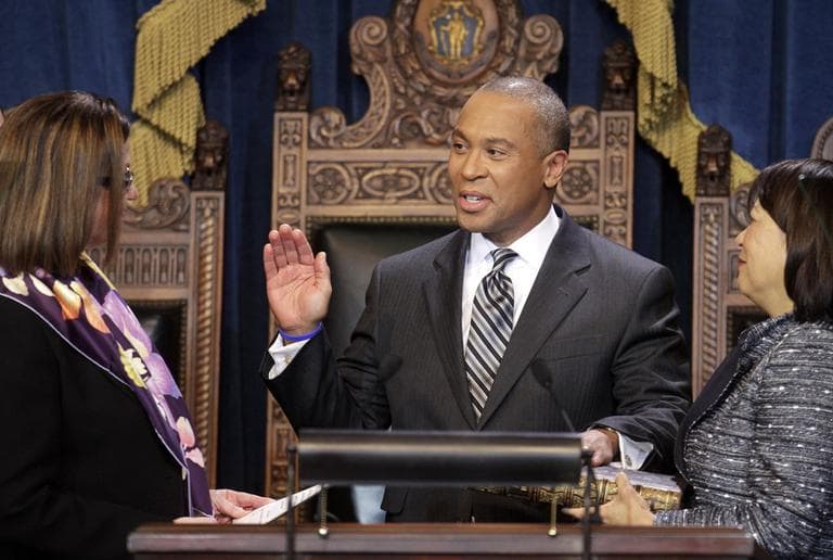 Gov. Deval Patrick, center, is administered the oath of office by Mass. Senate President Therese Murray, left, as his wife holds the Bible, Thursday. (AP)