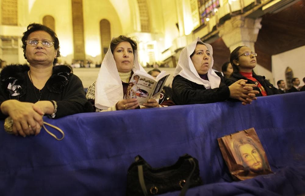 Coptic Christian women attend Christmas Eve Mass at the Coptic cathedral in Cairo, Egypt. (AP)
