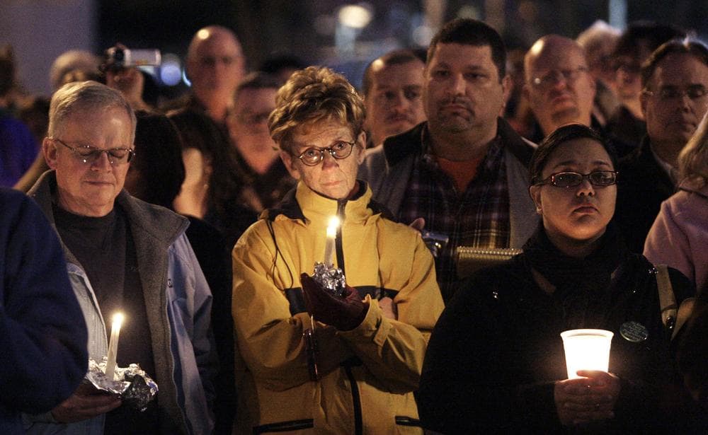 Hundreds gather for a vigil at the Arizona Capitol Saturday. (AP Photo/Ross D. Franklin)