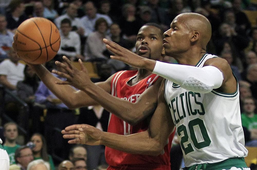 Boston guard Ray Allen, right, tries to stop Houston guard Aaron Brooks, left, on a drive to the basket during the second half of the game in Boston on Monday. Brooks had 24 points as the Rockets beat the Celtics 108-102. (AP)
