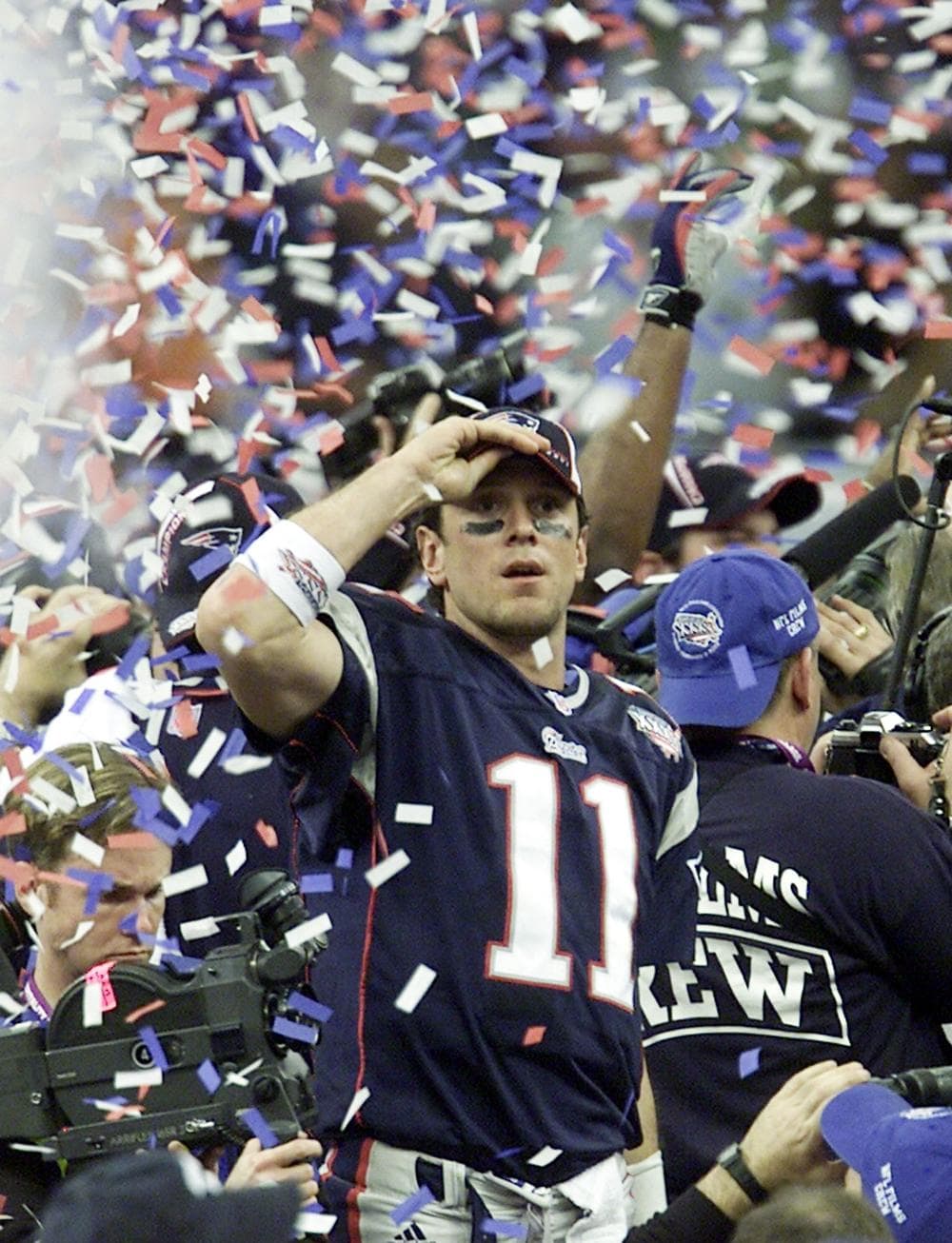 Bledsoe celebrates as confetti drop from New Orleans Superdome after the Patriots won the Super Bowl in 2002. (AP)