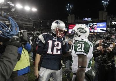 New England Patriots quarterback Tom Brady talks with New York Jets running back LaDainian Tomlinson after the fourth quarter of an NFL football game in Foxborough, Mass. (AP)