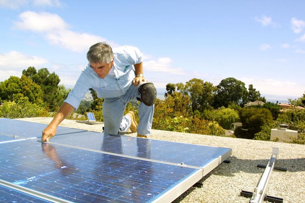 A contractor from Green Mountain Energy Company installs solar rooftop panels at a home in Northern California.(PRNewsFoto/Green Mountain Energy Company)