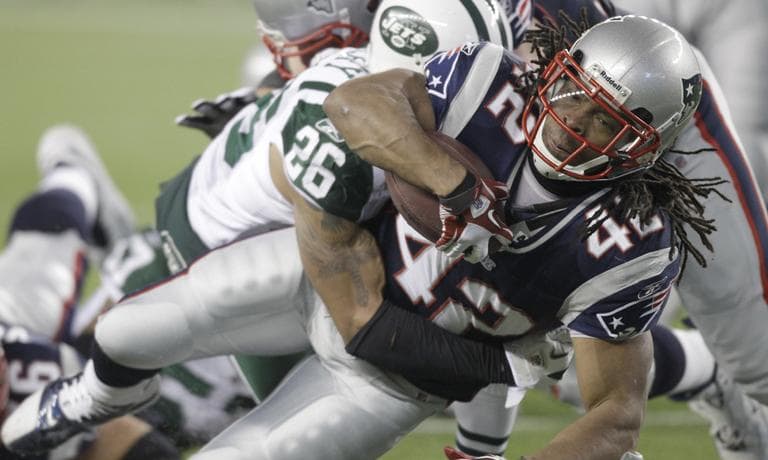 New York Jets cornerback Dwight Lowery tackles New England Patriots running back BenJarvus Green-Ellis during the second half of their playoff game. (AP)